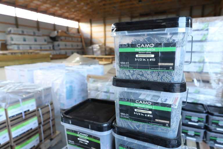 Stacks of bulk Camo premium deck screws, protech coated